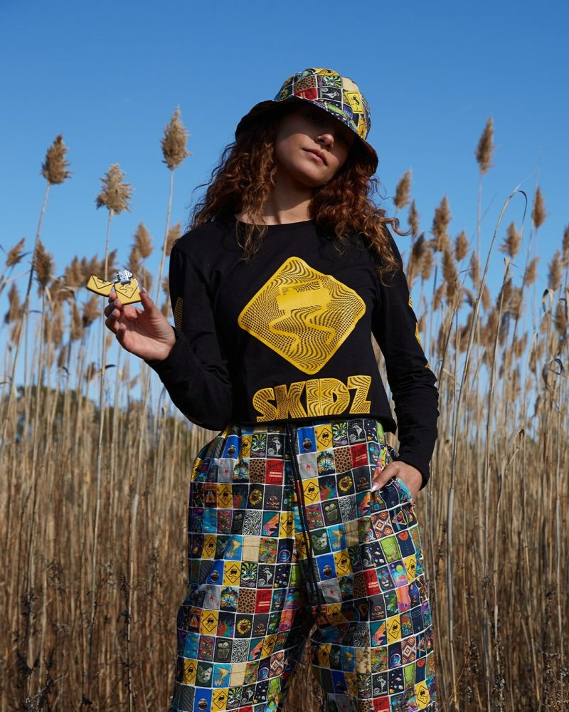 The three-piece Zippo X SKIDZ capsule collection features unisex SKIDZ original one-size drawstring pant and reversible bucket hat along with a coordinating Zippo windproof lighter.